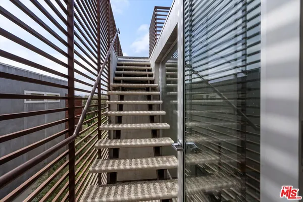 a view of roof deck with patio