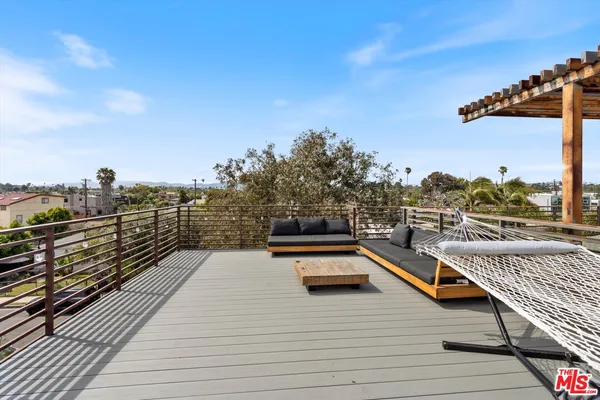 a view of a balcony with chairs