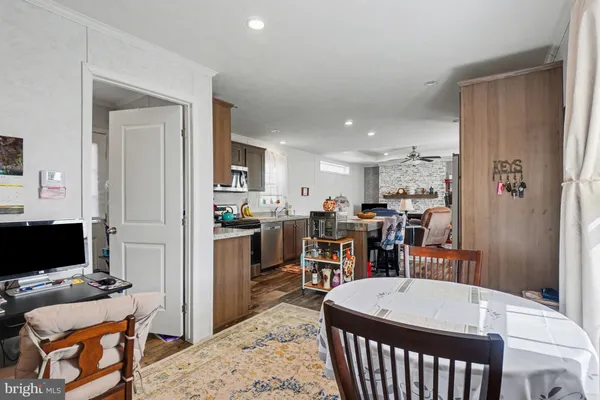 a room with furniture a flat screen tv and a table
