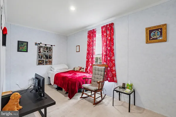 a bedroom with furniture and a bed