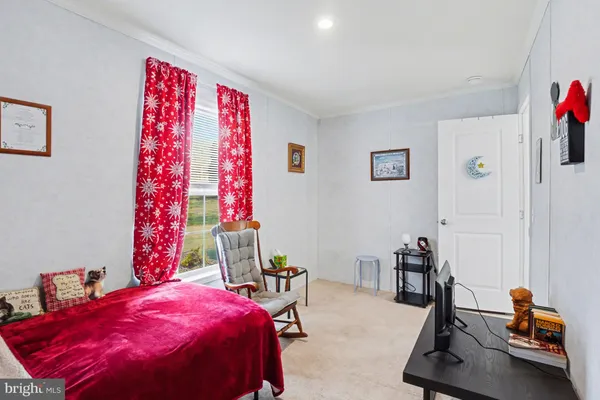 a bedroom with furniture and a chandelier