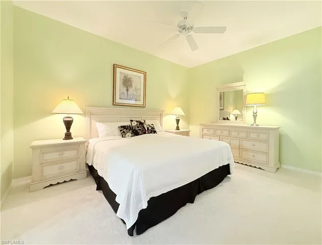 a bedroom with a bed and a table