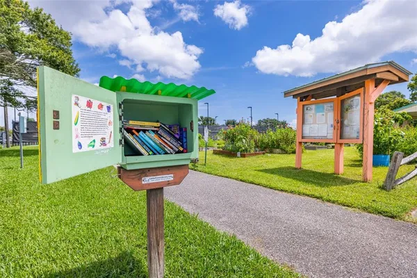 a sign that is in front of flowers