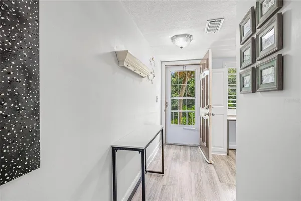a view of a hallway with front door