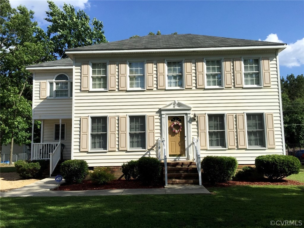 7317 Trailing Rock Road Prince George, VA 23875 - Photo 1 of 17 a front view of a house with a yard