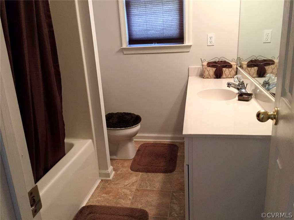 7317 Trailing Rock Road Prince George, VA 23875 - Photo 14 of 17 a bathroom with a sink and a toilet