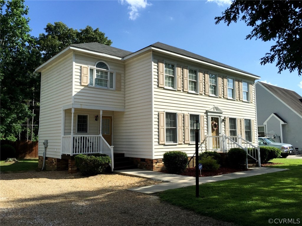 7317 Trailing Rock Road Prince George, VA 23875 - Photo 2 of 17 a front view of a house with a yard