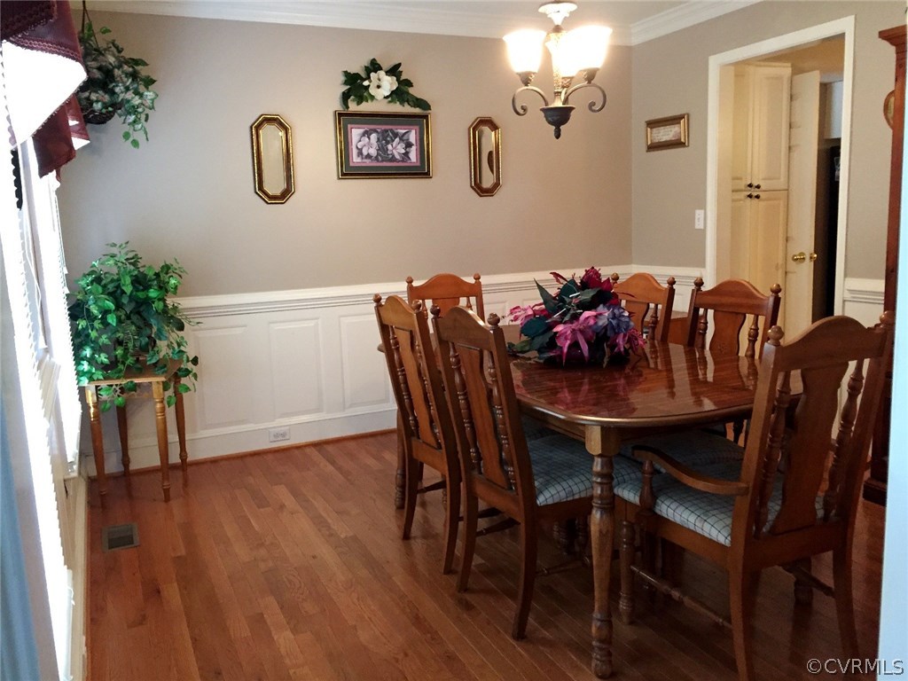 7317 Trailing Rock Road Prince George, VA 23875 - Photo 3 of 17 a view of a dining room with furniture and wooden floor