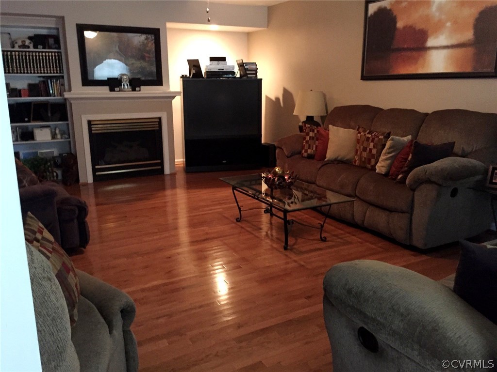 7317 Trailing Rock Road Prince George, VA 23875 - Photo 4 of 17 a living room with furniture and a fireplace