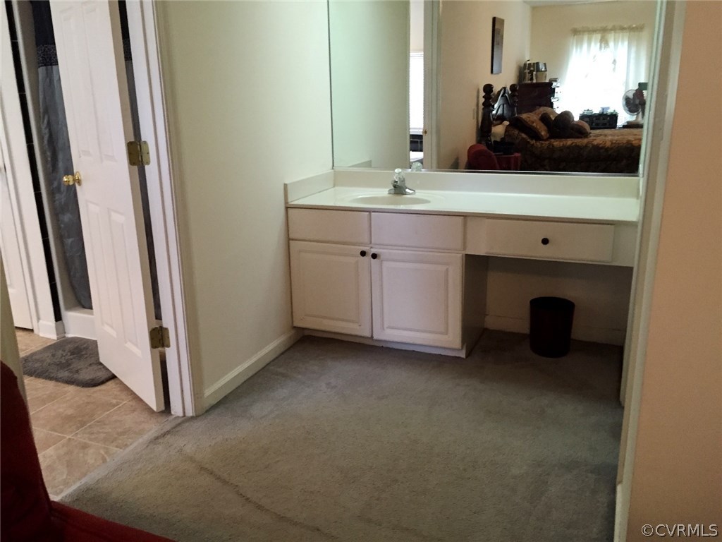 7317 Trailing Rock Road Prince George, VA 23875 - Photo 9 of 17 a view of a double sink and mirror in a room