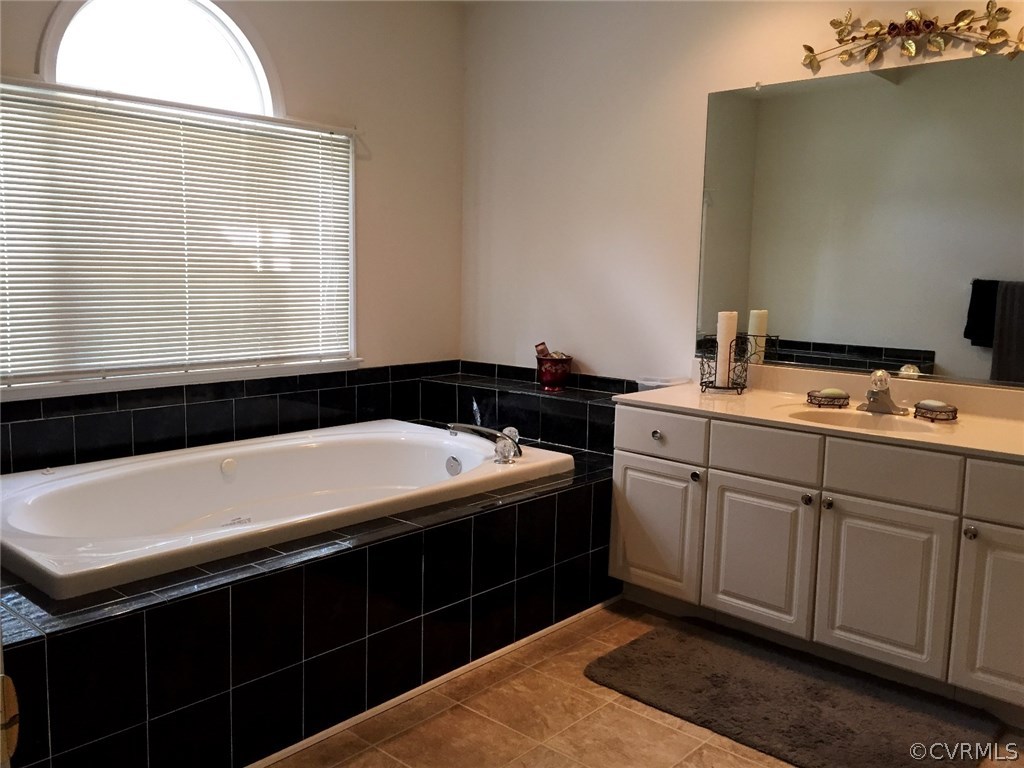 7317 Trailing Rock Road Prince George, VA 23875 - Photo 10 of 17 a kitchen that has a sink and a stove