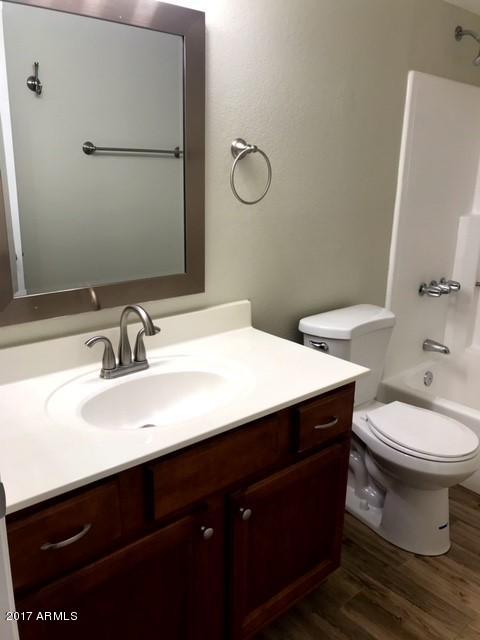 700 East Mesquite Circle, Unit N127 Tempe, AZ 85288 - Photo 11 of 16 a bathroom with a sink and a toilet
