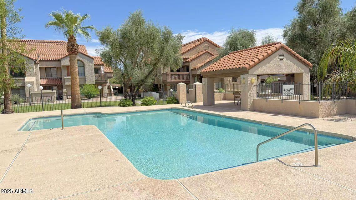 700 East Mesquite Circle, Unit N127 Tempe, AZ 85288 - Photo 14 of 16 a view of a house with a swimming pool