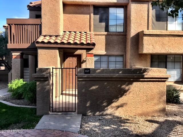 700 East Mesquite Circle, Unit N127 Tempe, AZ 85288 - Photo 2 of 16 a front view of a house with garden