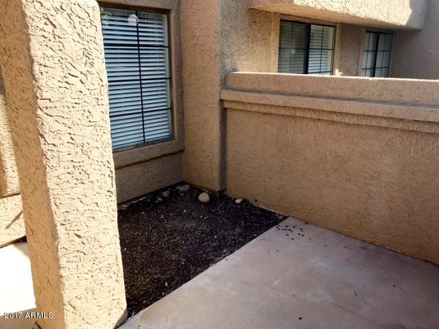700 East Mesquite Circle, Unit N127 Tempe, AZ 85288 - Photo 3 of 16 a room that has a window in it