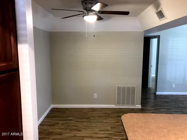 700 East Mesquite Circle, Unit N127 Tempe, AZ 85288 - Photo 8 of 16 a view of a livingroom with wooden floor