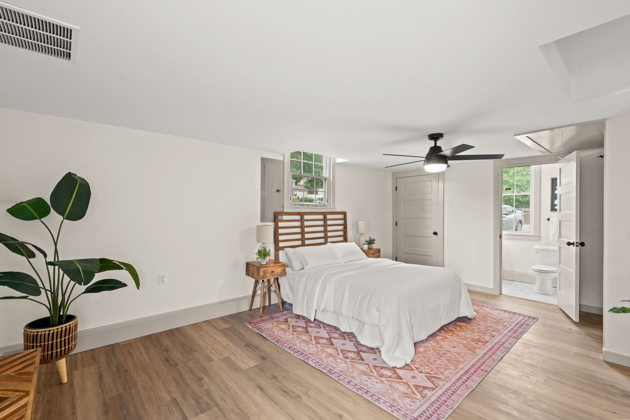 3004 Anderson Road Nashville, TN 37217 - Photo 12 of 28 a bedroom with a bed potted plant with the wooden floor