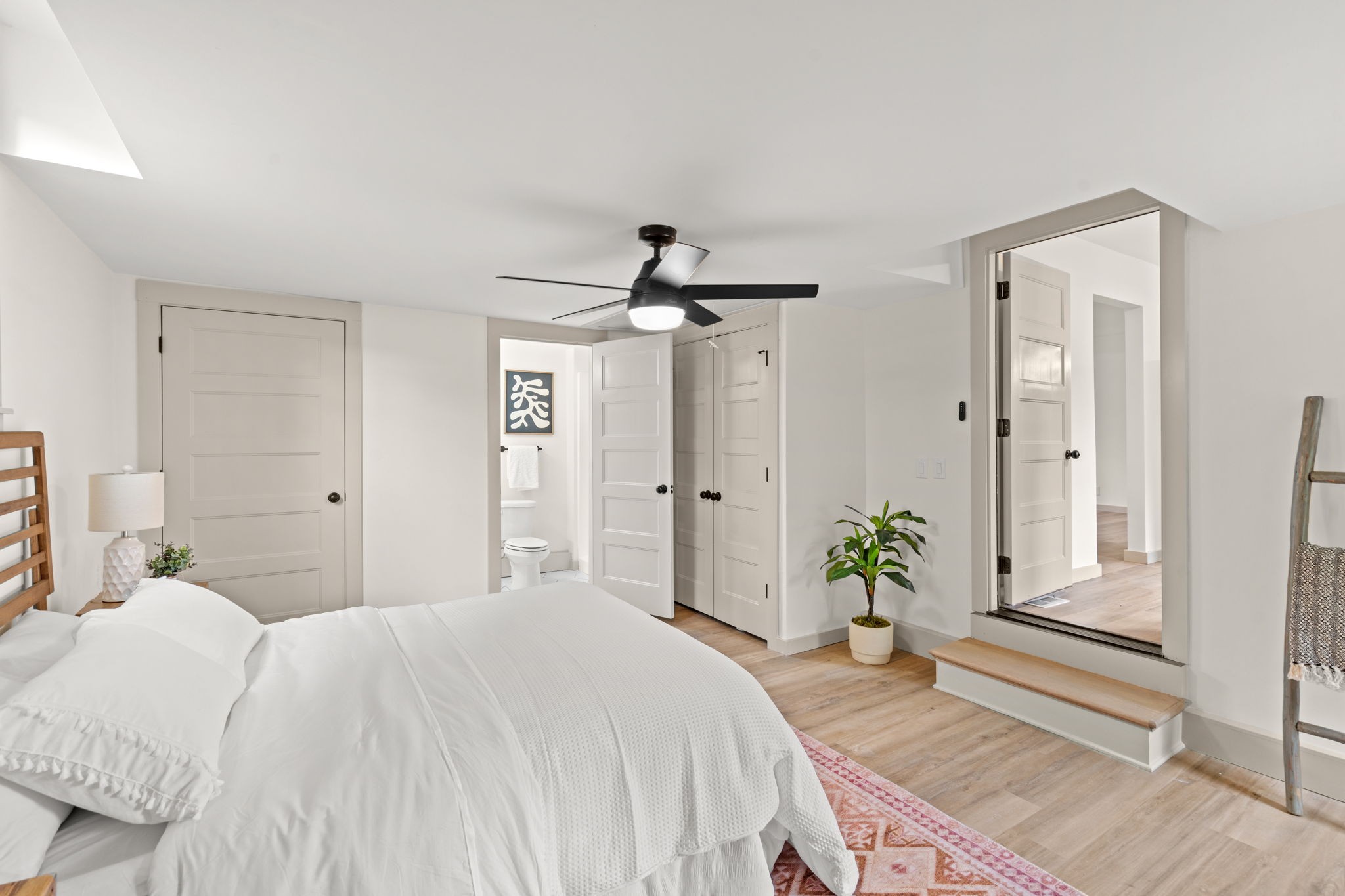 3004 Anderson Road Nashville, TN 37217 - Photo 13 of 28 a bedroom with a bed and a chandelier