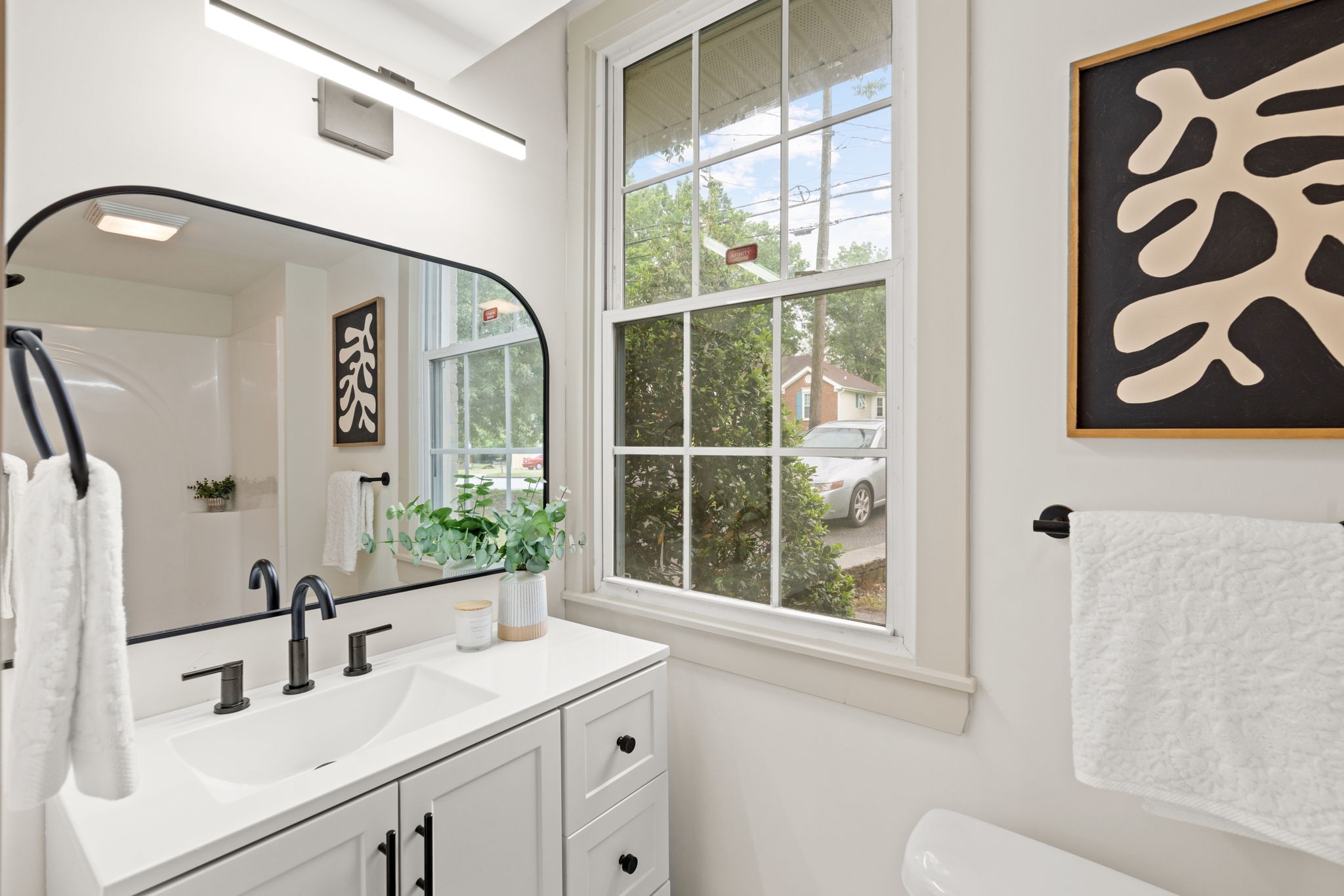 3004 Anderson Road Nashville, TN 37217 - Photo 15 of 28 a bathroom with a sink and a mirror