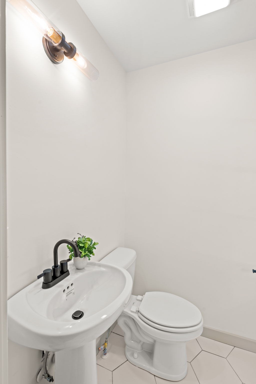 3004 Anderson Road Nashville, TN 37217 - Photo 23 of 28 a white toilet sitting next to a bathroom sink