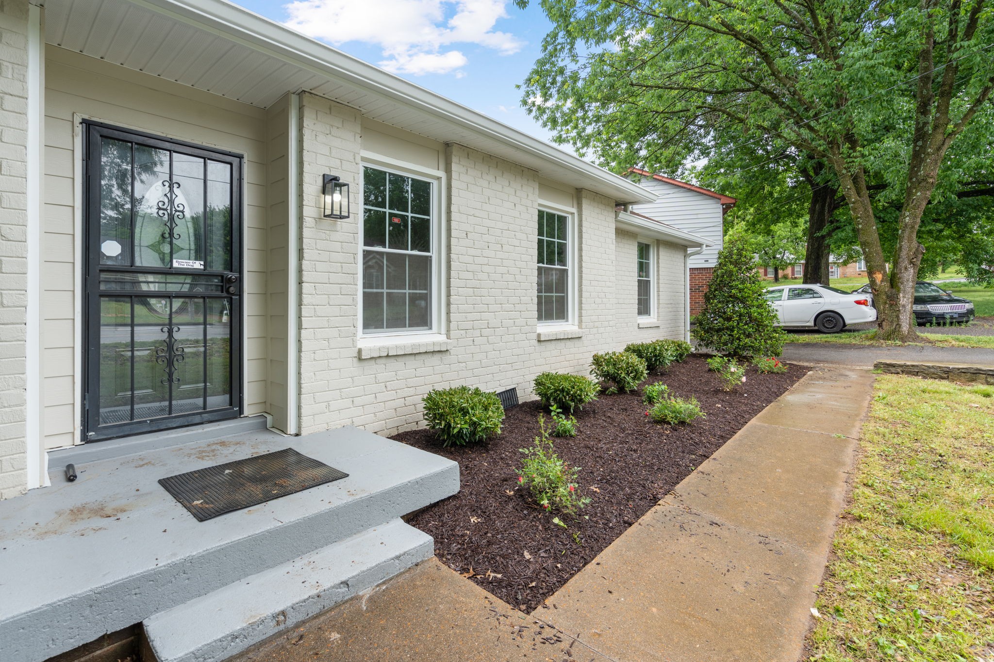 3004 Anderson Road Nashville, TN 37217 - Photo 3 of 28 a front view of a house with garden