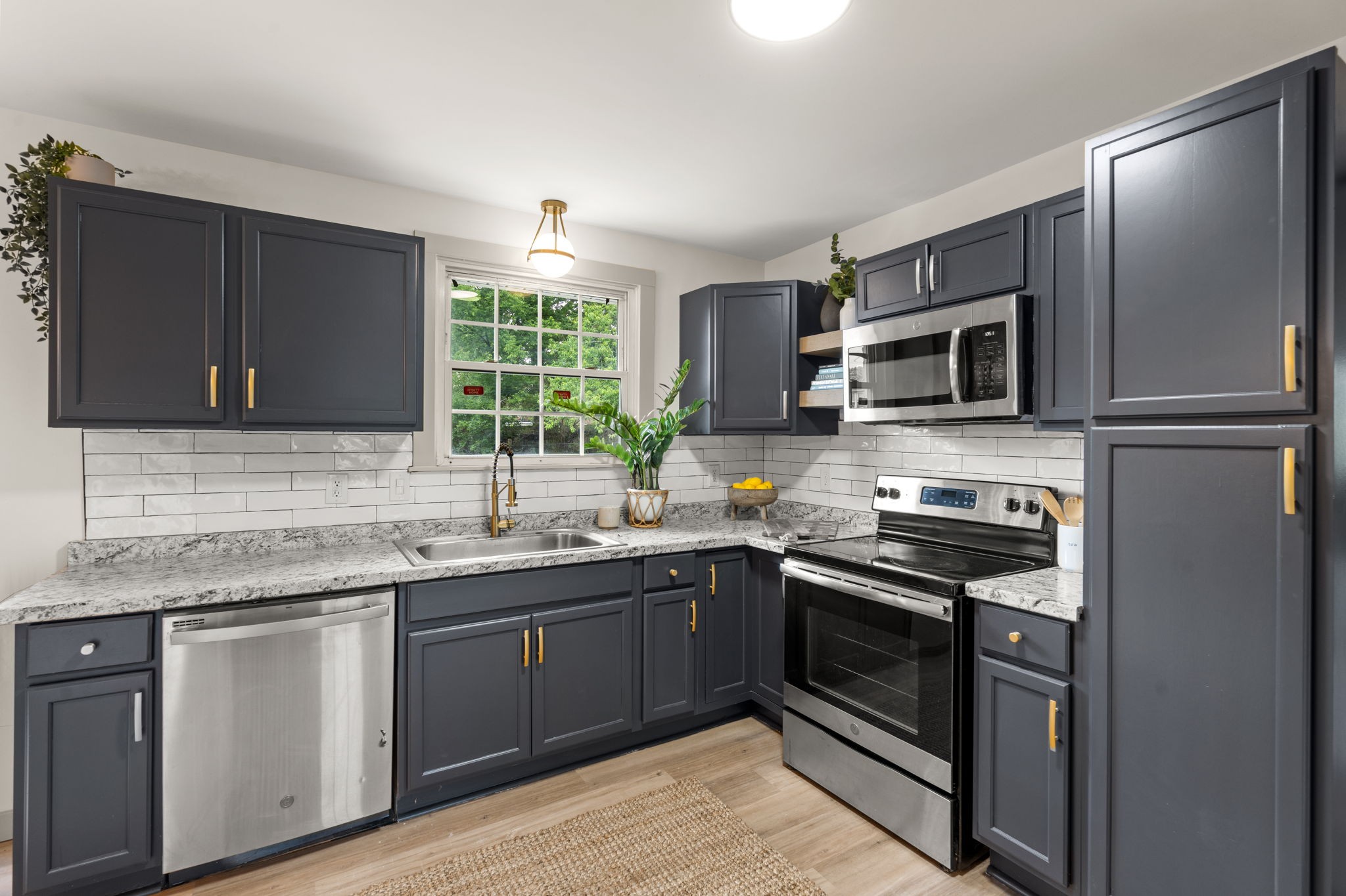 3004 Anderson Road Nashville, TN 37217 - Photo 10 of 28 a kitchen with a sink stove and microwave