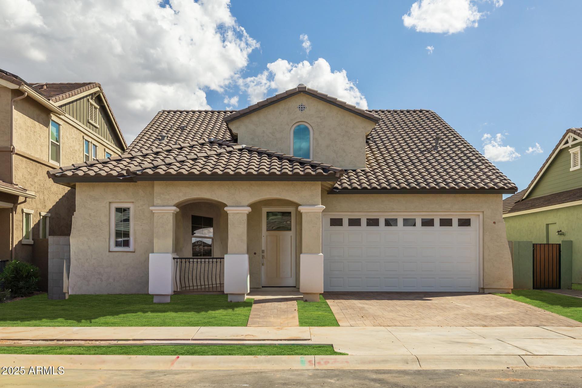 4273 East John Street Gilbert, AZ 85295 - Photo 1 of 29 a front view of a house with a garage
