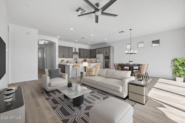 an empty room with a ceiling fan and a window