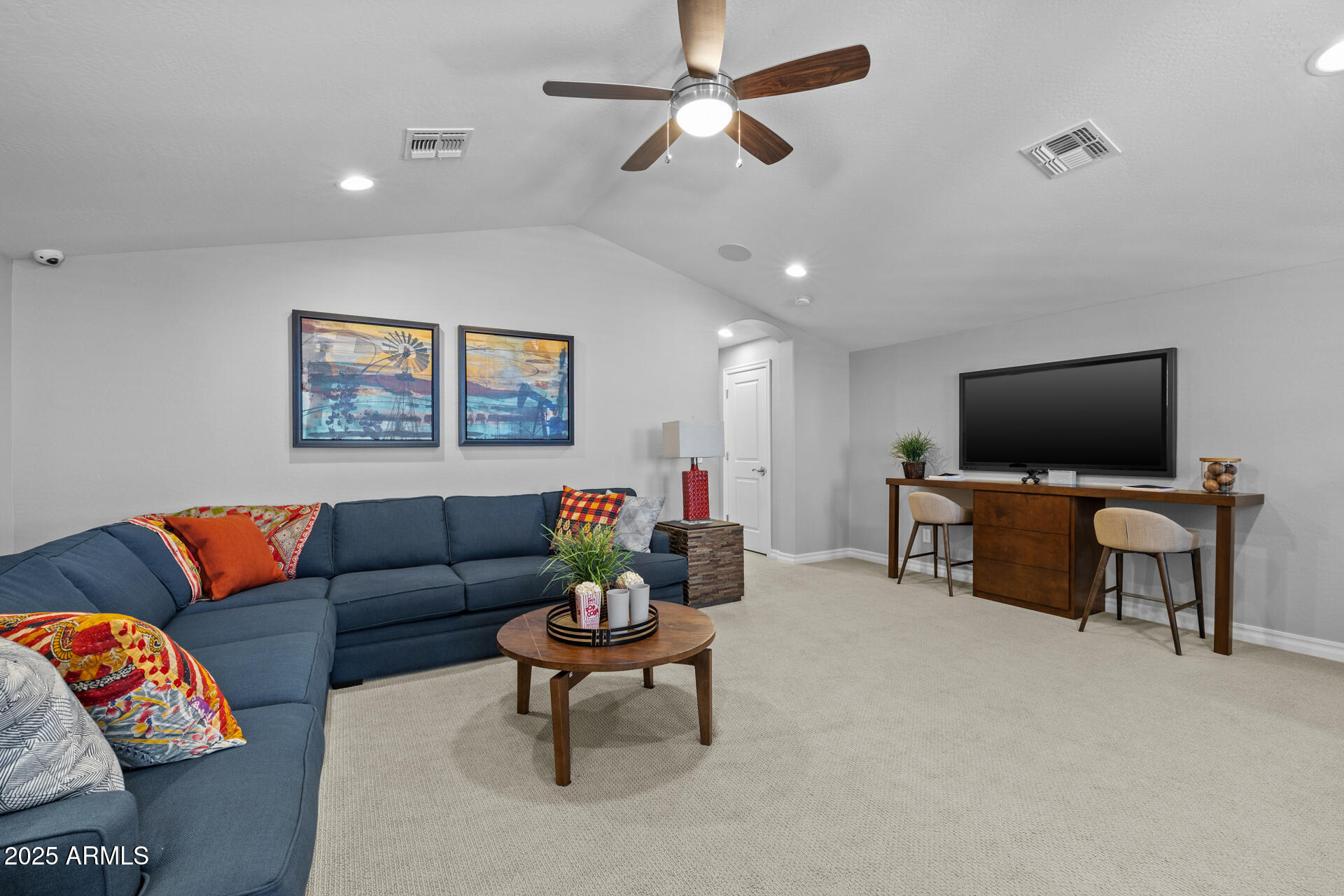 4273 East John Street Gilbert, AZ 85295 - Photo 12 of 29 a living room with furniture and a flat screen tv