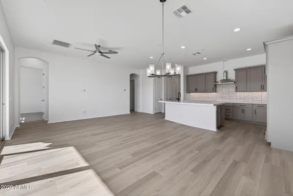 a bedroom with a bed and a potted plant