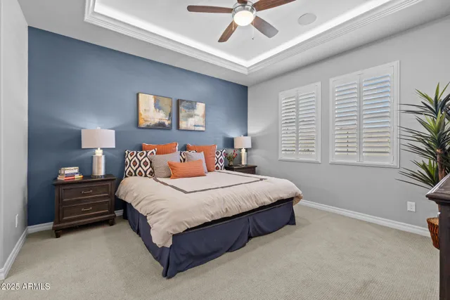 a bedroom with a bed and a television