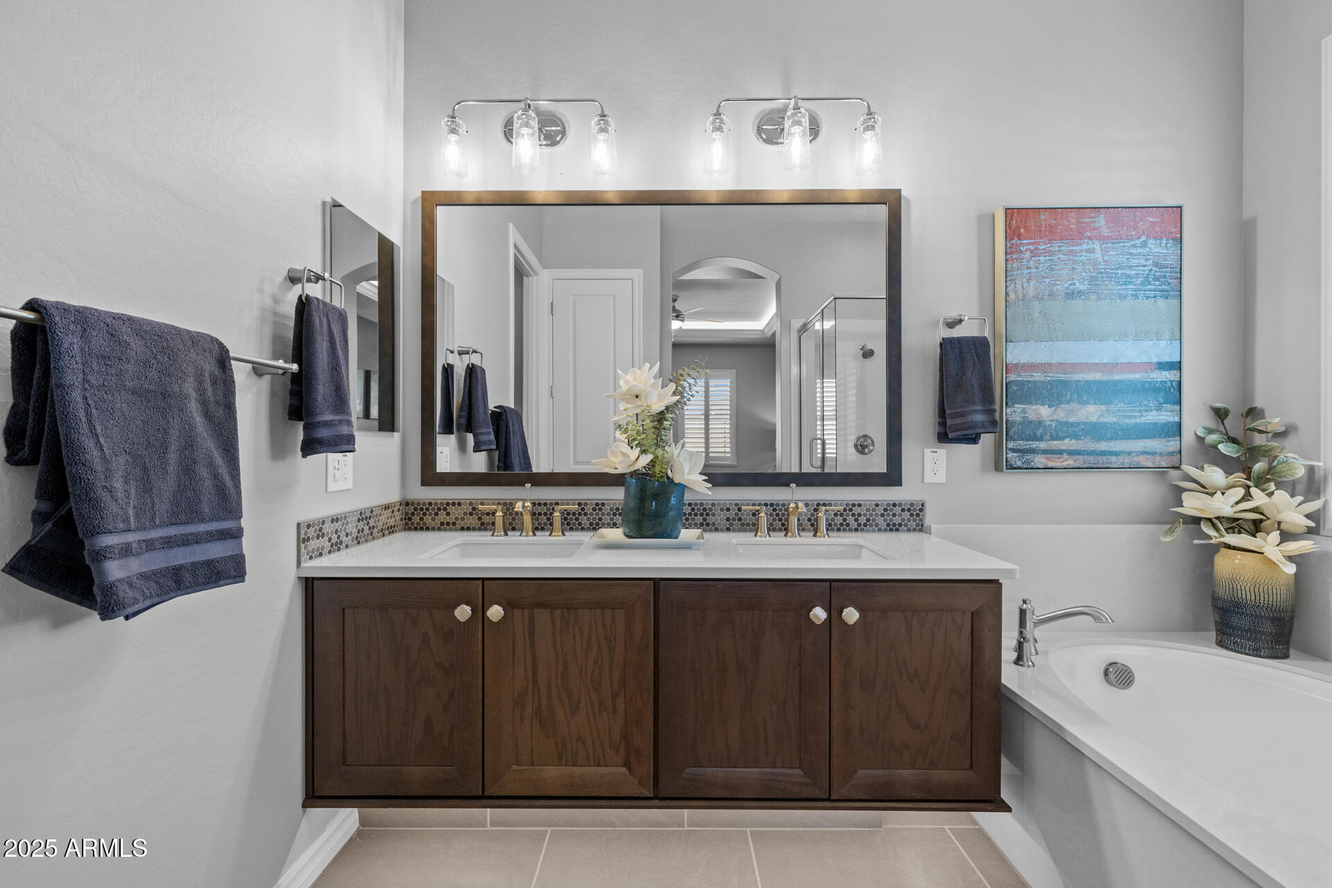 4273 East John Street Gilbert, AZ 85295 - Photo 17 of 29 a bathroom with a double vanity sink and a mirror