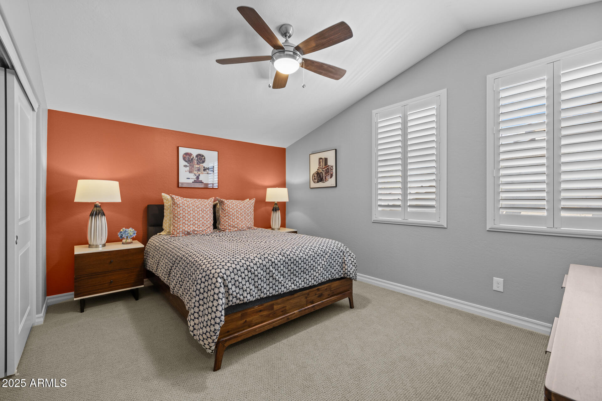 4273 East John Street Gilbert, AZ 85295 - Photo 18 of 29 a spacious bedroom with a bed and a window