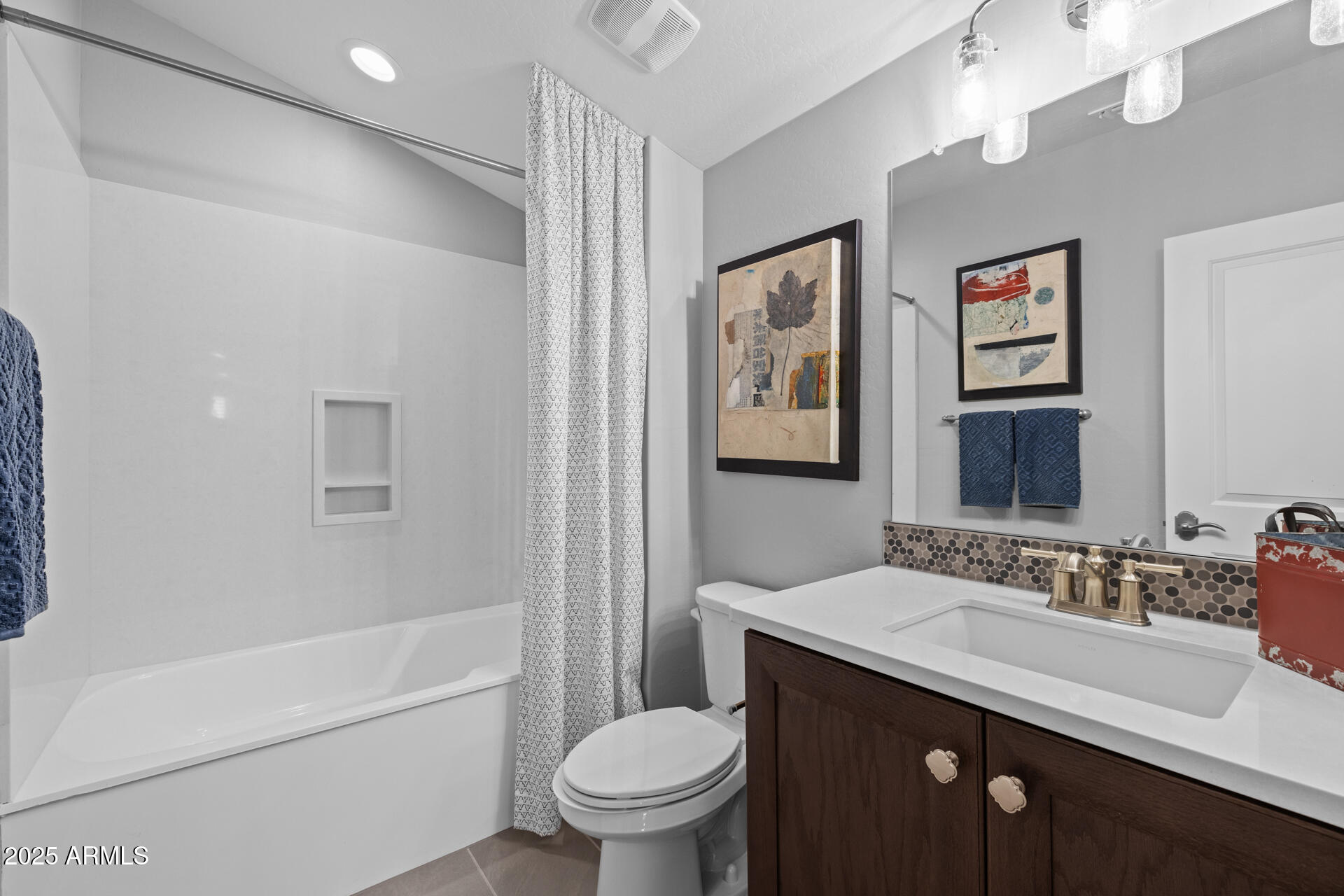 4273 East John Street Gilbert, AZ 85295 - Photo 19 of 29 a bathroom with a sink a toilet and shower