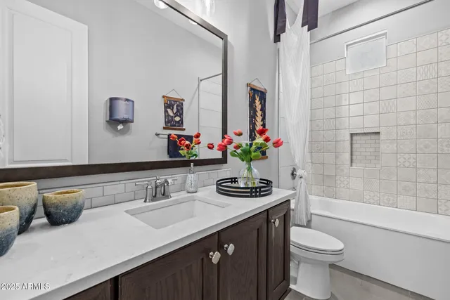 a bedroom with a bed and a tv in it