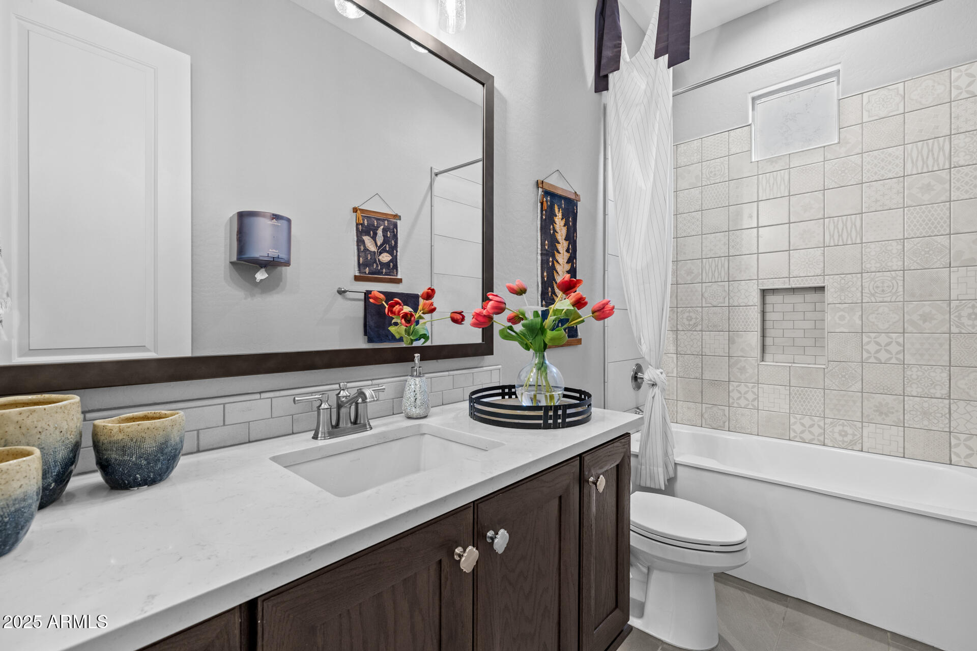 4273 East John Street Gilbert, AZ 85295 - Photo 21 of 29 a bathroom with a sink a toilet and shower