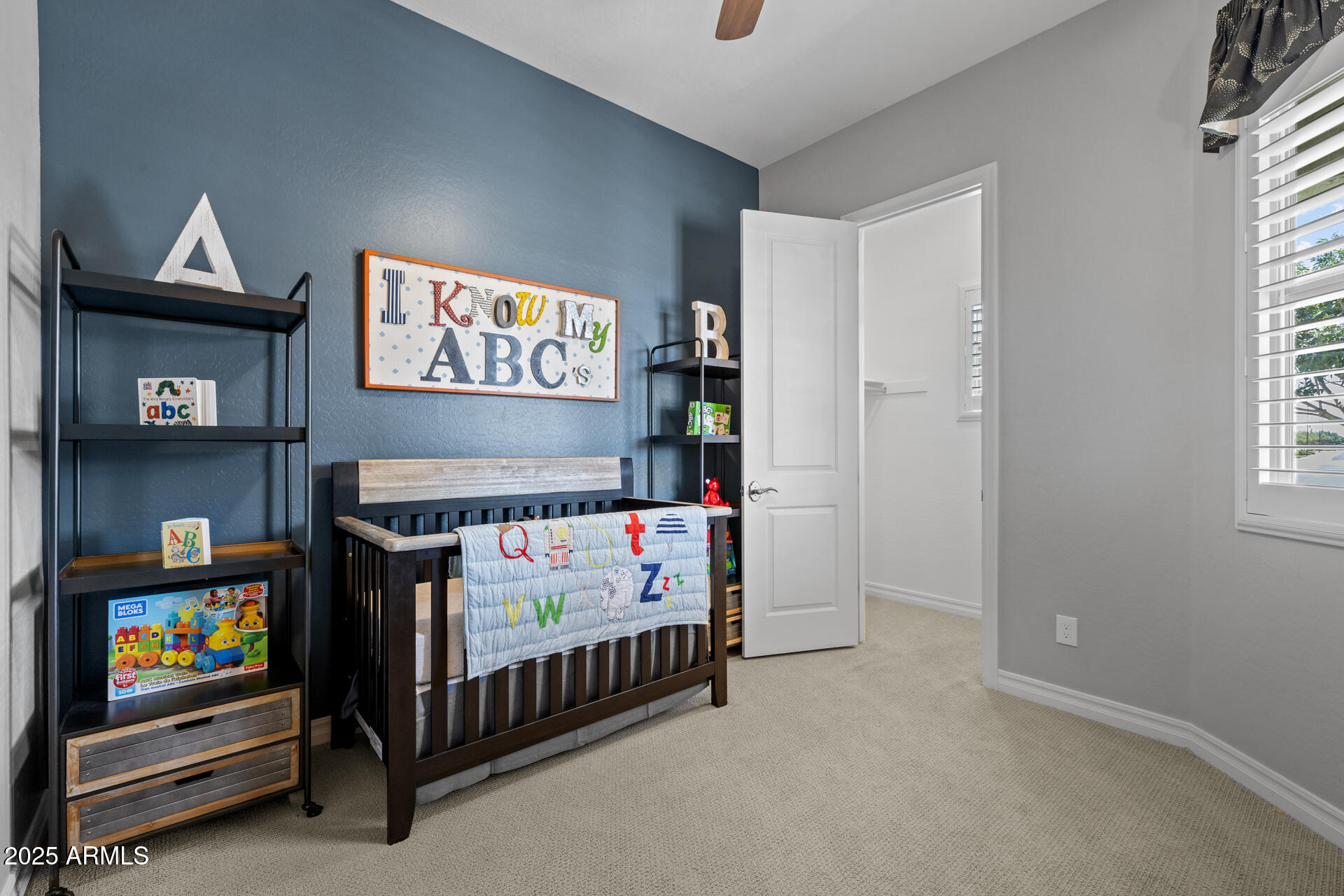 4273 East John Street Gilbert, AZ 85295 - Photo 22 of 29 a bedroom with a bed and a tv in it