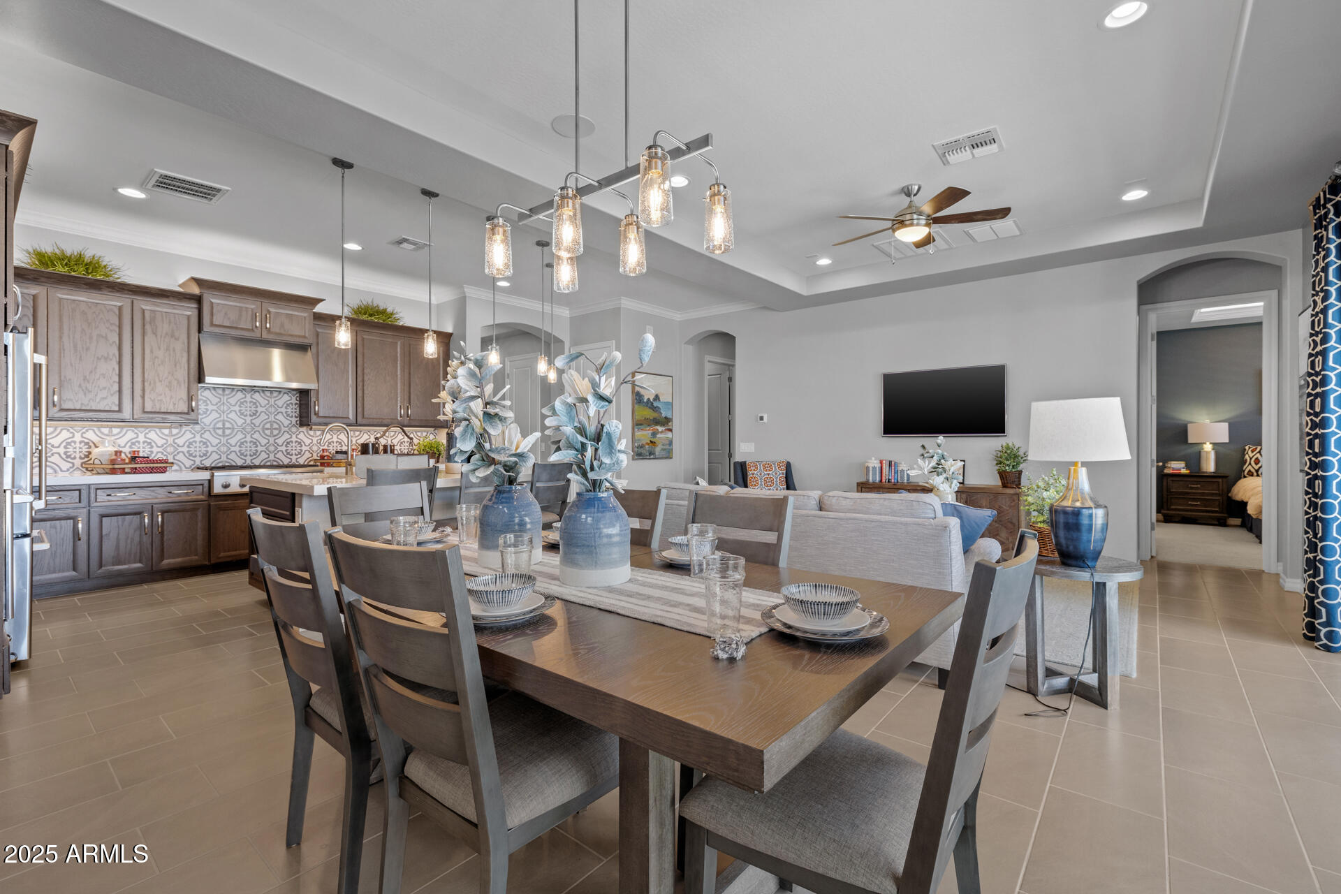 4273 East John Street Gilbert, AZ 85295 - Photo 10 of 29 a view of a dining room with furniture and a chandelier