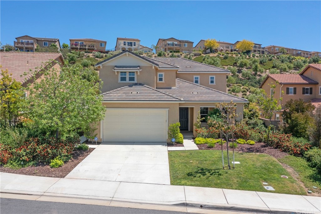 44209 Nighthawk Pass Temecula, CA 92592 - Photo 1 of 1 a front view of a house with a yard and potted plants