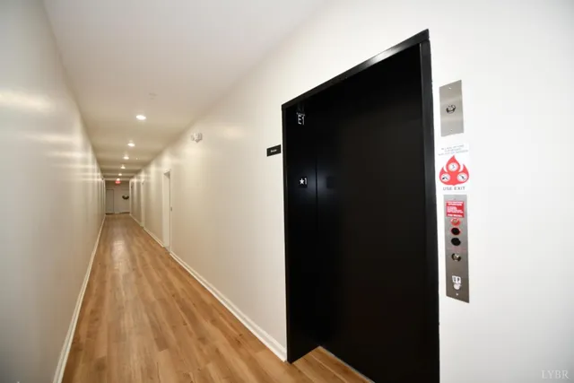 a kitchen with stainless steel appliances a refrigerator sink and microwave