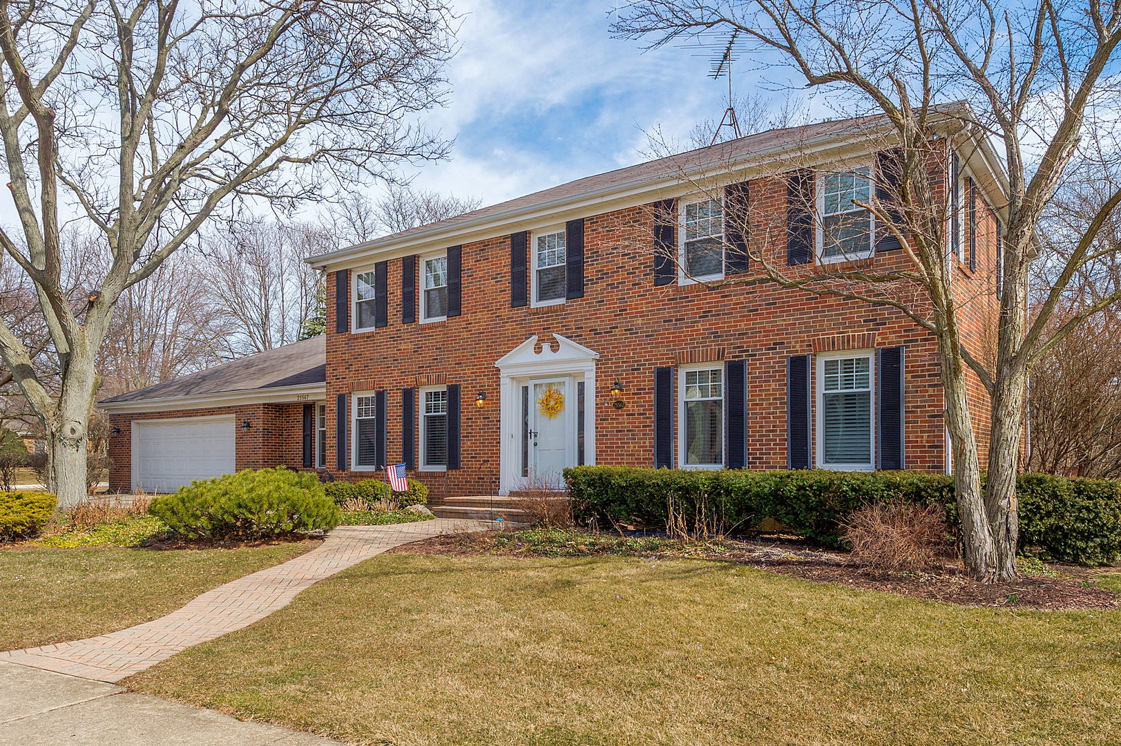 2S567 White Birch Lane Wheaton, IL 60189 - Photo 2 of 31 a front view of a house with yard and trees around