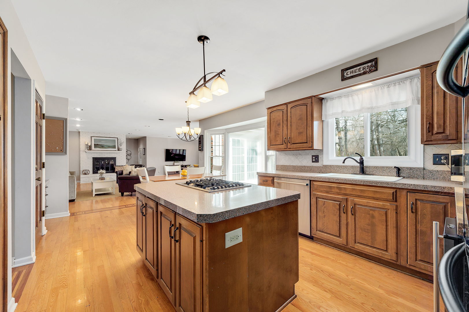 2S567 White Birch Lane Wheaton, IL 60189 - Photo 11 of 31 a kitchen with a sink stove and cabinets