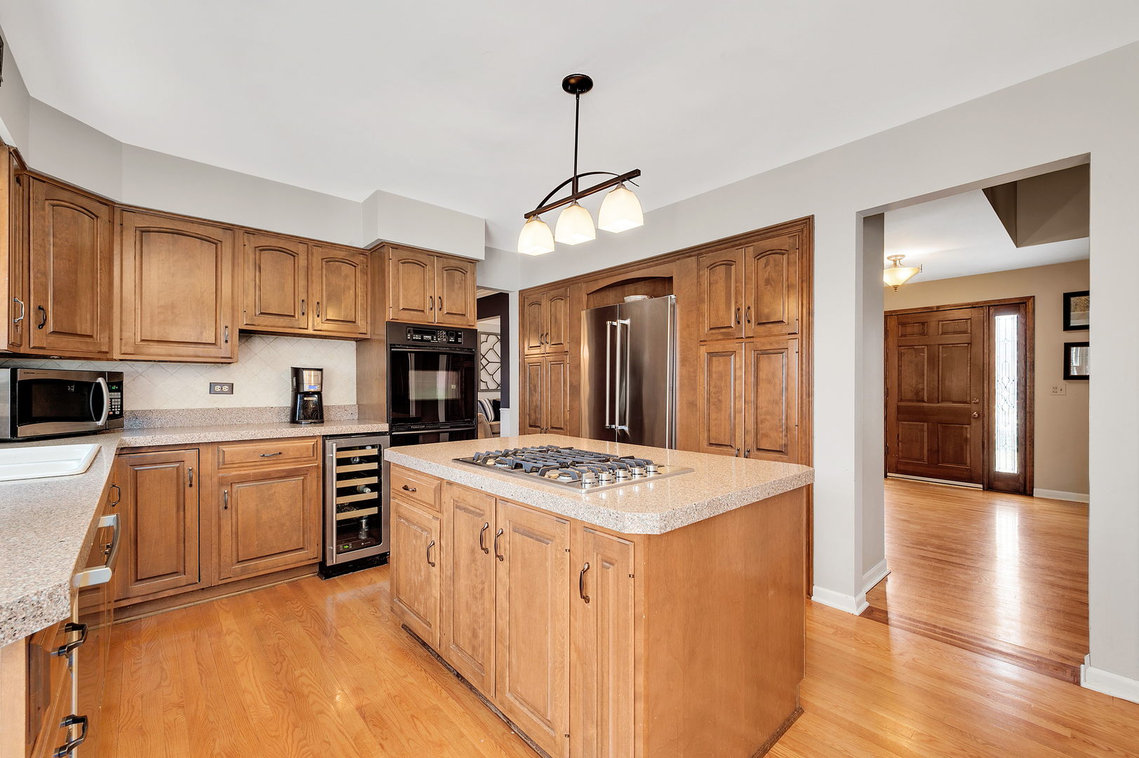 2S567 White Birch Lane Wheaton, IL 60189 - Photo 13 of 31 a kitchen with stainless steel appliances granite countertop a stove top oven a refrigerator a sink and dishwasher with white cabinets