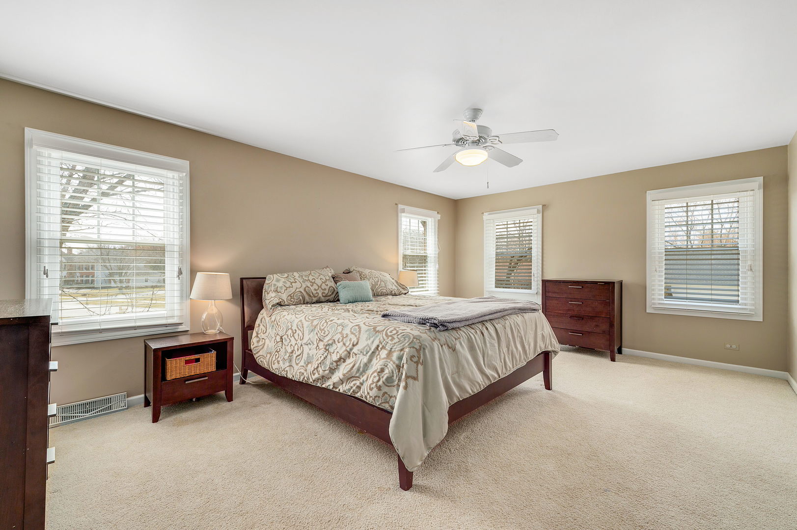 2S567 White Birch Lane Wheaton, IL 60189 - Photo 17 of 31 a spacious bedroom with a bed a dresser and a chandelier
