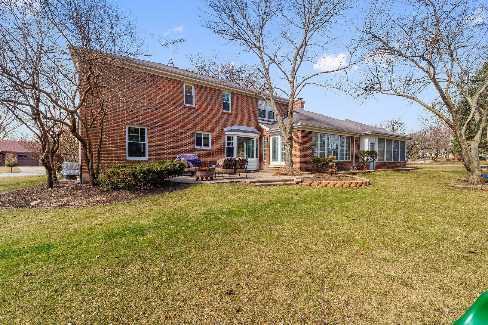 2S567 White Birch Lane Wheaton, IL 60189 - Photo 29 of 31 a front view of a building with garden and trees