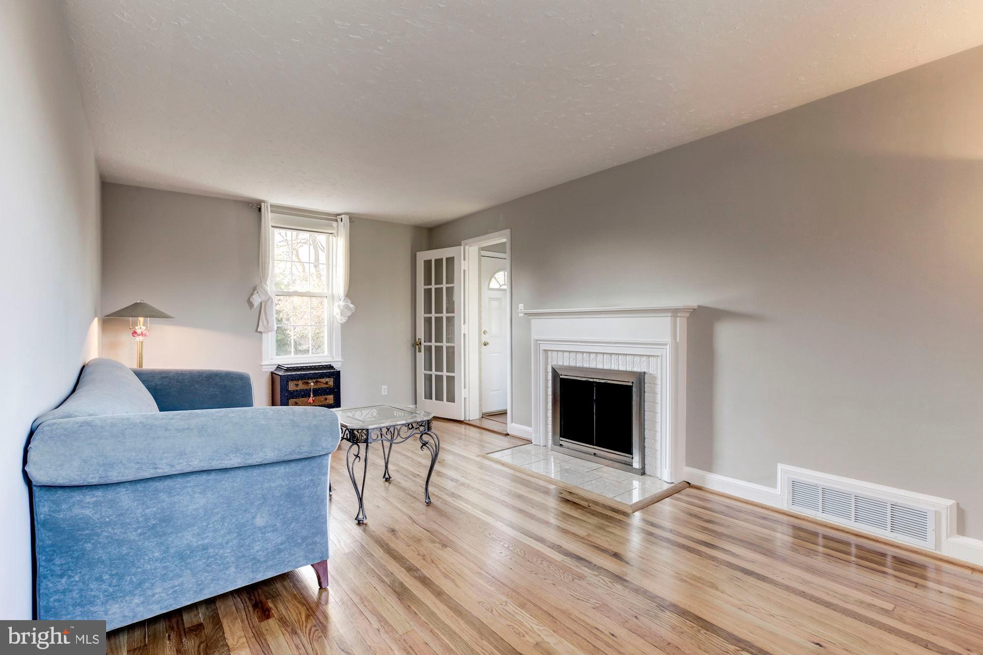 10030 Dallas Avenue Silver Spring, MD 20901 - Photo 10 of 24 Living room with wood burning fireplace