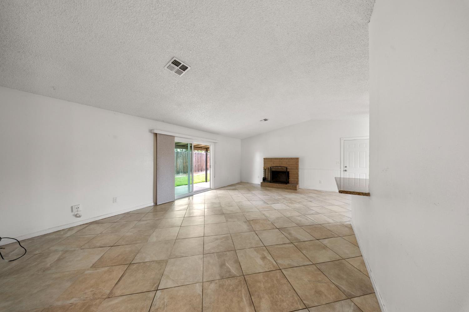 1120 Shasta Avenue Modesto, CA 95358 - Photo 13 of 35 a view of an empty room with a window