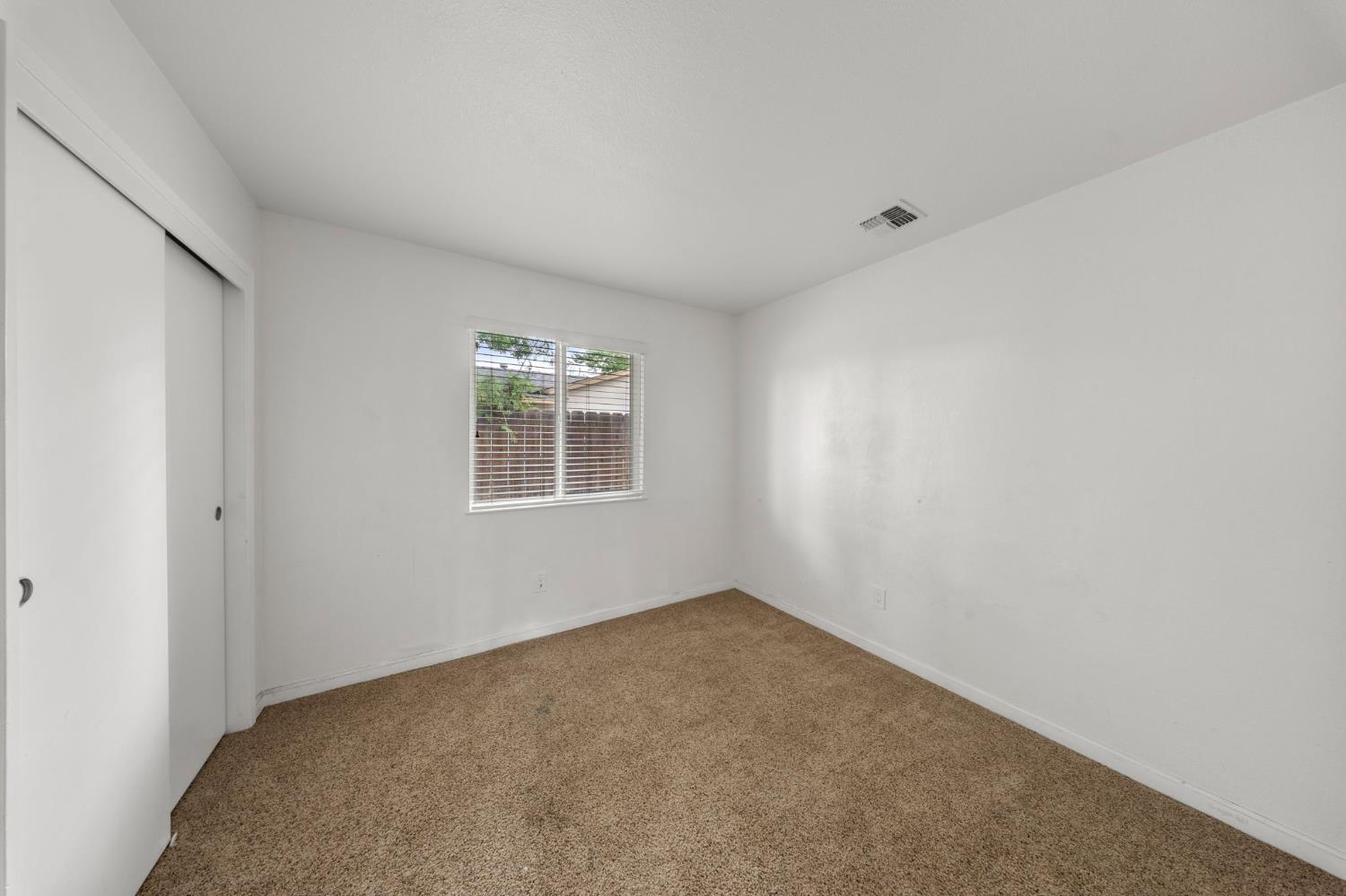 1120 Shasta Avenue Modesto, CA 95358 - Photo 16 of 35 a view of an empty room with a window