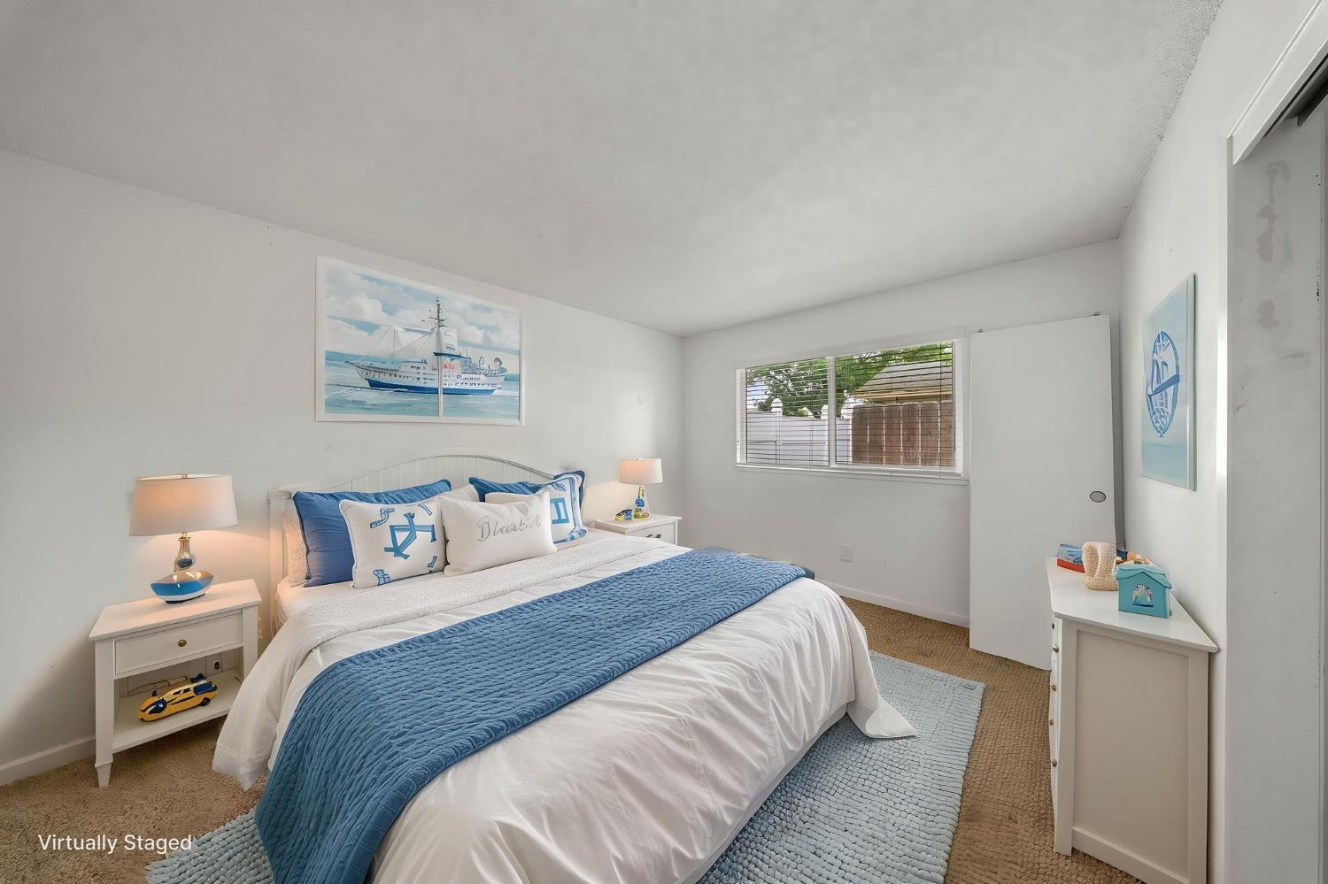 1120 Shasta Avenue Modesto, CA 95358 - Photo 21 of 35 a bedroom with a bed and a window