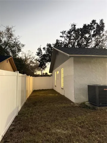 a view of a livingroom with an empty space and a window